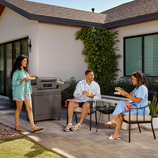 TYTUS outdoor grill in use, showcasing quick-assembly and durable design for patio grilling.
