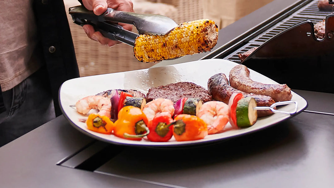 TYTUS Grill with Cooked Food: Corn, Shrimp Skewers, Burger, Sausages on Plate, Outdoor Grilling